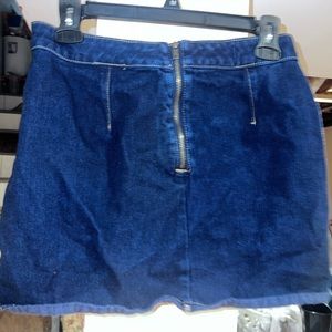 Denim blue skirt, gold zipper in the middle backside